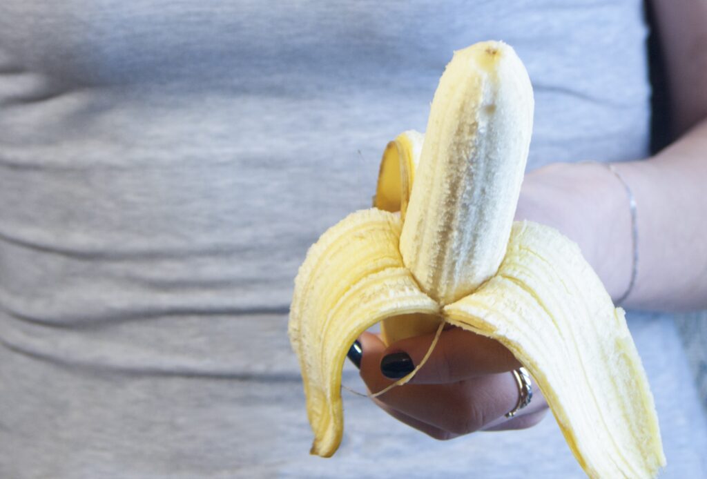 woman holding a banana